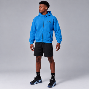DRIMEX Men's Blue Zip-Up Hoodie with DX Logo worn by an athlete holding a basketball